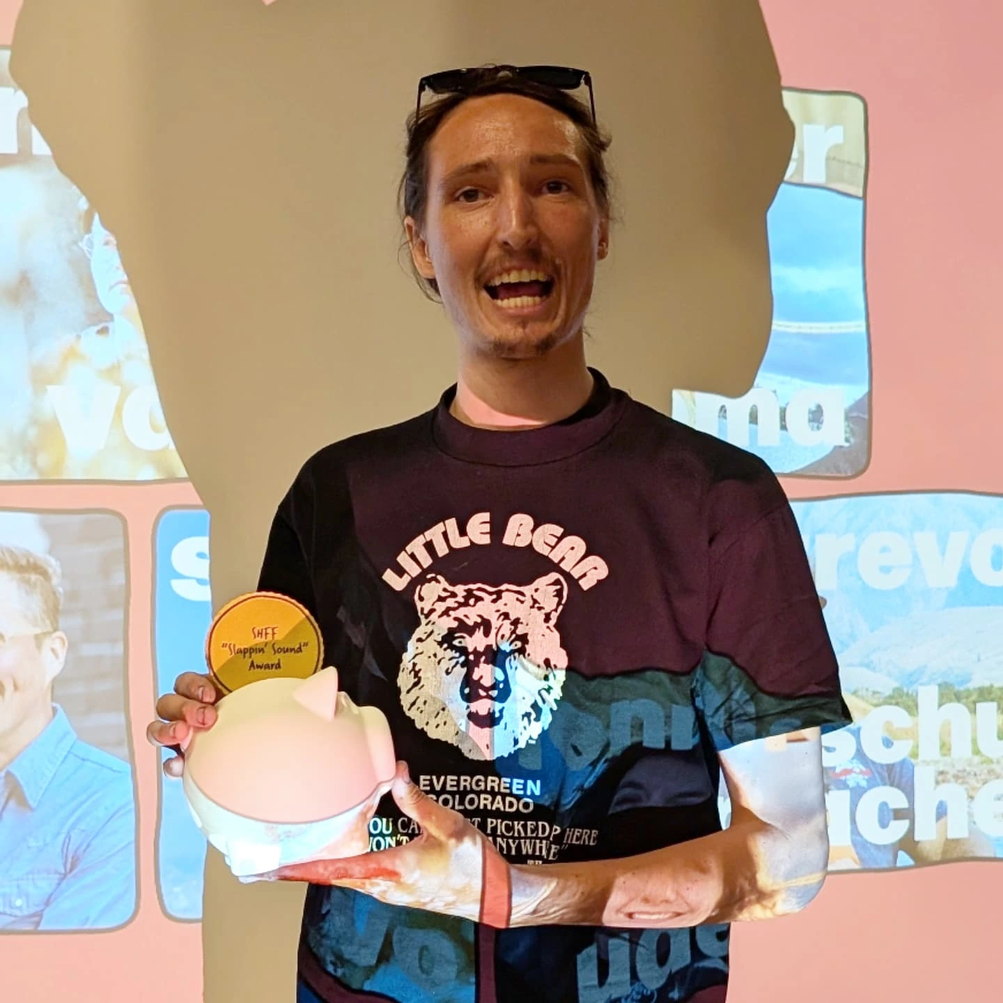 2025 Side Hustle Film Fest Slappin' Sound winner Andy Olson — holding the 3D printed coin pig award