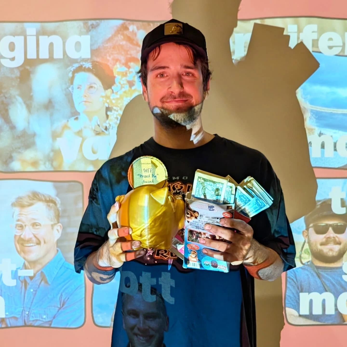 2025 Side Hustle Film Fest Prized Pig winner Kavon Zamanian — holding the 3D printed coin pig award and two VHS tape covers filled with cash